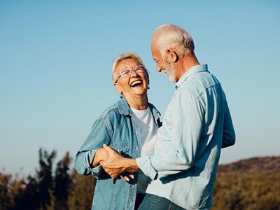 Senior couple enjoying the benefits of their dental implants