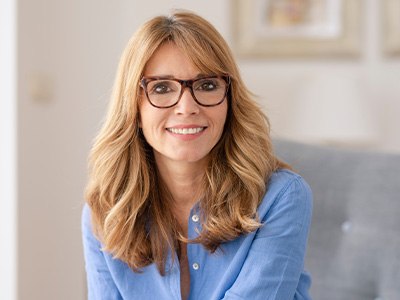 Woman smiling after dental implant post-op instructions in Encinitas 