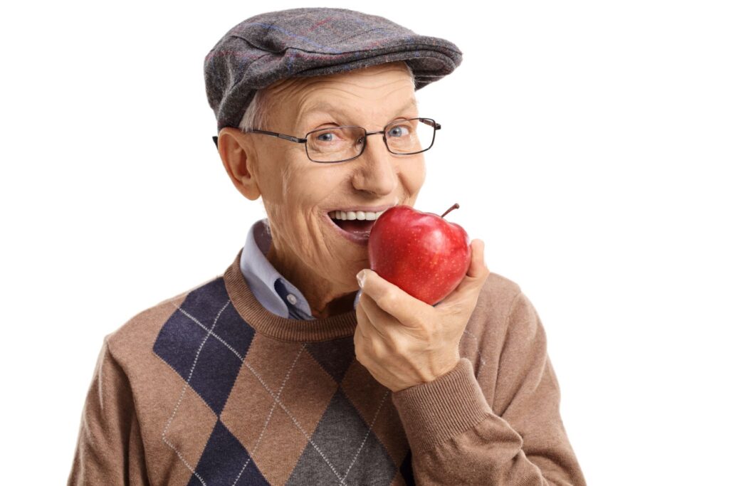 A man biting into an apple